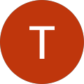A red circular icon with a white letter T in the center.